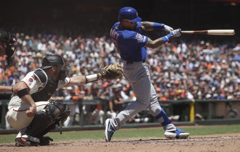 AP Photo, Javier Baez, Stephen Vogt,Javier Báez de los Cachorros de Chicago conecta un doble frente al receptor de los Gigantes de San Francisco, Stephen Vogt, durante el tercer inning del juego en San Francisco, el miércoles 24 de julio de 2019. (AP Foto/Jeff Chiu)